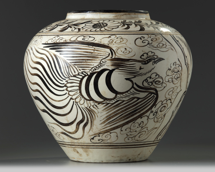 A large Chinese Cizhou-style 'dragon and phoenix' jar