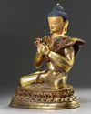 A Tibetan gilt bronze figure of Maitreya