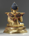 A Tibetan gilt bronze figure of Maitreya