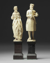 A pair of European 'Dieppe' figs on wooden stands