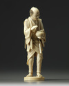 An ivory carving of a man holding a lantern