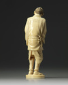 An ivory carving of a man holding a lantern