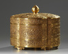 A large Chinese brass lobed three-tiered box and cover