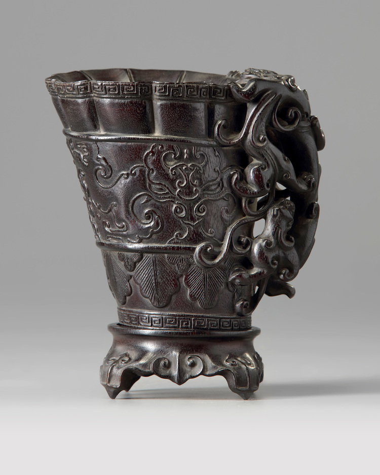 A Chinese zitan libation cup and stand