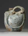 A Chinese green-glazed dragon-handled water flask