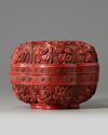 A Chinese cinnabar lacquer 'prunus' box and cover