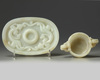 A Chinese white jade ‘twin chilong’ cup stand and a pale celadon jade cup