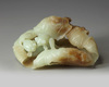 A large Chinese celadon and russet jade ‘lotus and gold fish’ carving