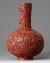 A Chinese cinnabar lacquer ‘peaches’ bottle vase
