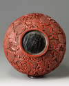 A Chinese cinnabar lacquer ‘peaches’ bottle vase