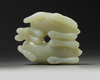 A Chinese pale celadon ‘twin ram’ carving