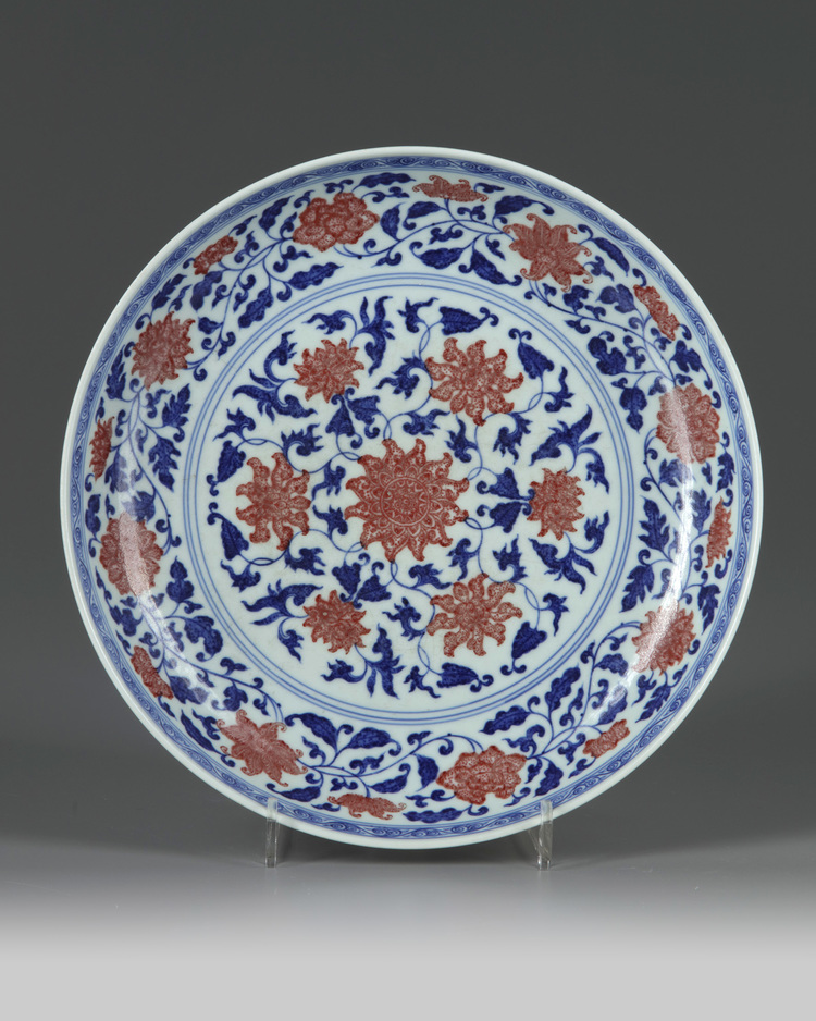 A Chinese underglaze blue and copper-red decorated 'lotus' dish
