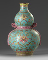 A Chinese turquoise-ground famille rose double gourd vase