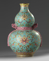A Chinese turquoise-ground famille rose double gourd vase