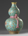 A Chinese turquoise-ground famille rose double gourd vase