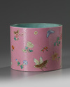 A Chinese pink-ground sgraffiato famille rose 'butterflies and flowers' brush pot, bitong