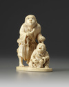 A Japanese ivory okimono of two figures and a frog