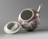 A Chinese puce-enamelled 'European subject' teapot and cover