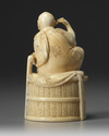 A JAPANESE OKIMONO OF A SEATED MAN