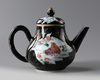 A Chinese mirror black-ground famille rose 'quails' teapot and cover