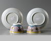 A pair of Chinese famille rose 'floral' cups and saucers