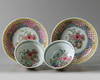 A pair of Chinese famille rose 'floral' cups and saucers