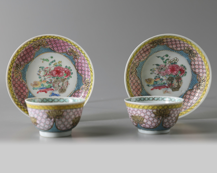 A pair of Chinese famille rose 'floral' cups and saucers