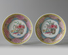 A pair of Chinese famille rose 'floral' cups and saucers