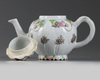A Chinese famille rose 'lotus' teapot and cover