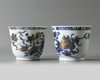 A PAIR OF CHINESE BLUE AND WHITE 'PEONY' CUPS AND SAUCERS, 18TH CENTURY