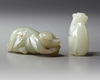 TWO CHINESE CELADON AND PALE CELADON JADE MONKEYS, 20TH CENTURY