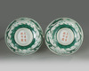A pair of Chinese green glazed 'dragon' bowls