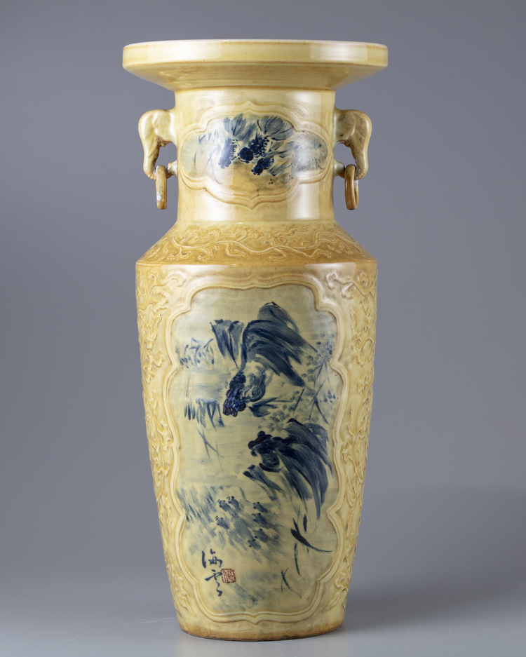 A creme ground blue and white vase