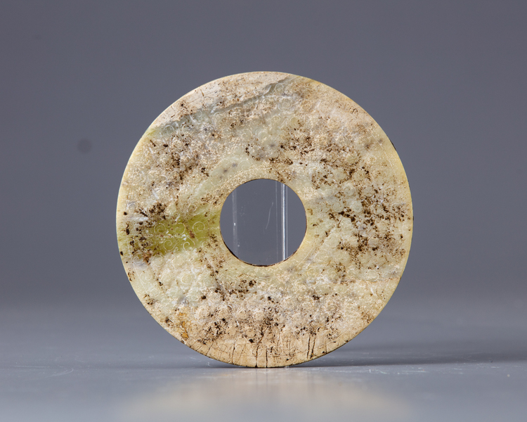 A carved jade Bi disc