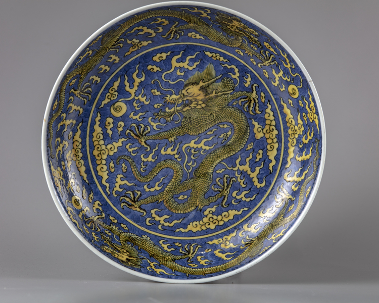 A blue-ground yellow enamelled 'dragon' dish