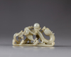 A pale celadon jade carving of a dragon and a chilong