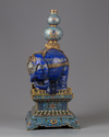 A lapis lazuli carving of a elephant with cloisonné mounts and stand