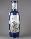 A blue glazed famille verte rouleau vase