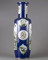 A blue glazed famille verte rouleau vase