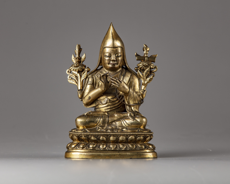 A Sino-Tibetan gilt bronze figure of a Lama