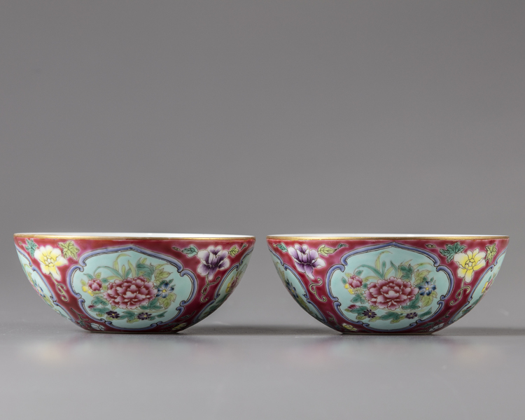 A pair of Chinese ruby-ground famille rose 'floral' bowls