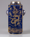 A gilt blue-ground cong vase