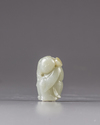 A Chinese jade carving of a boy