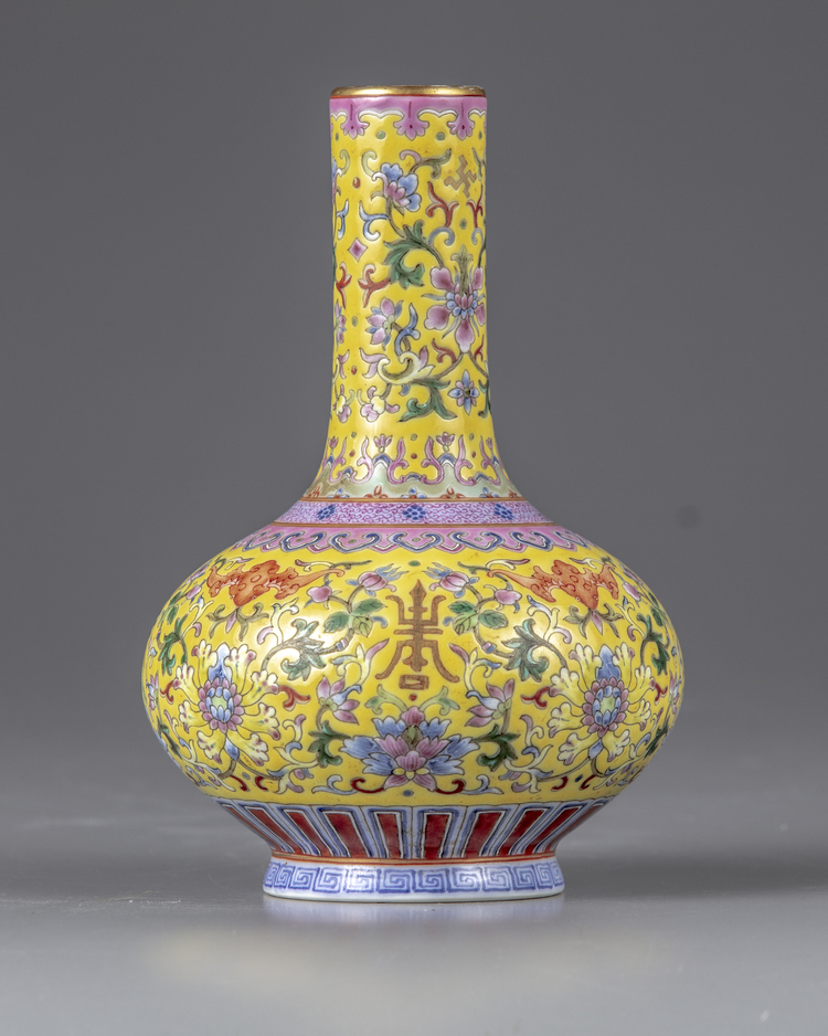 A yellow-ground famille rose bottle vase
