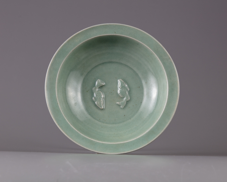 A CHINESE TWIN CARP CELADON BOWL, QING DYNASTY (1644-1911)