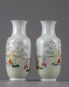 A PAIR OF CHINESE FAMILLE ROSE 'BOYS' VASES, 19TH-20TH CENTURY