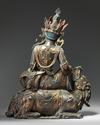 A bronze figure of guanyin seated on a mythical beast