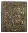 A brass plaque depicting various figures and animals