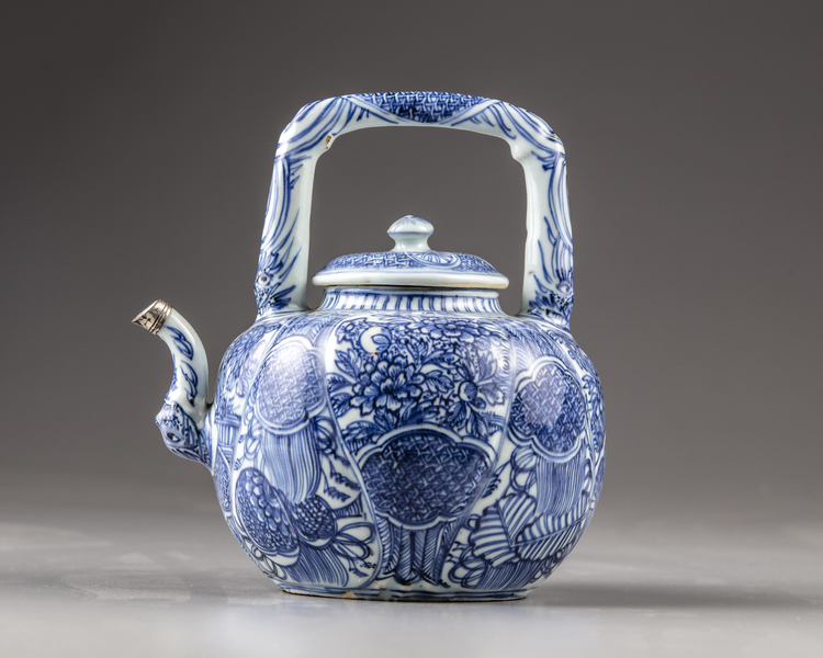 A silver-mounted Chinese blue and white moulded 'Kraak porcelain' wine pot