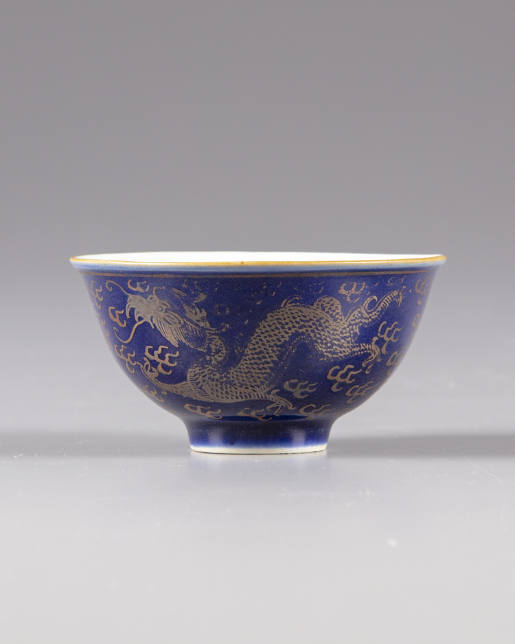 A gilt Chinese 'two dragons" cup